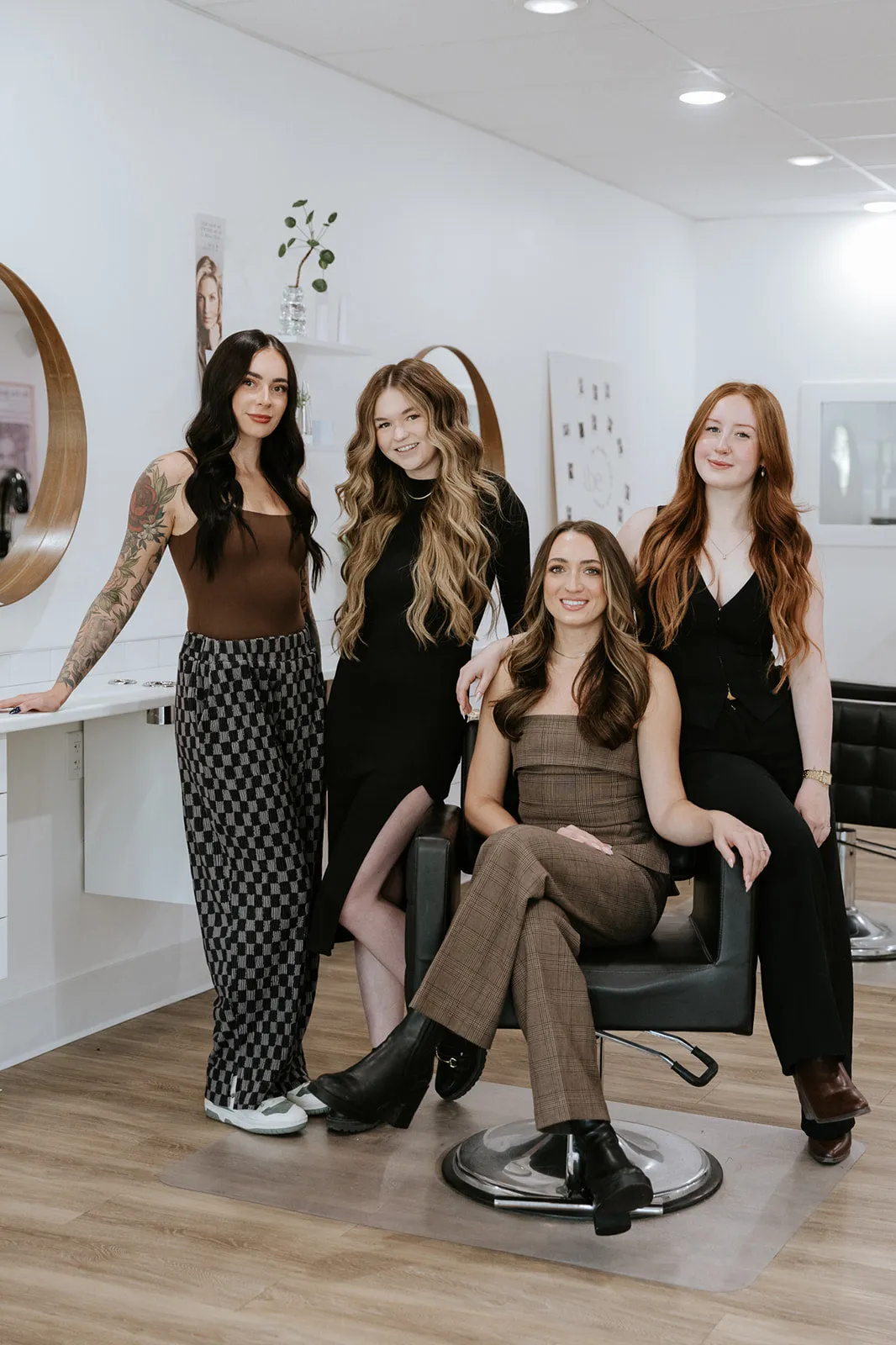 Hair stylist creating blonde highlights in Kelowna salon